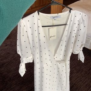 New with tags wrap dress with ties on sleeves . Super cute, fun, flowy dress.